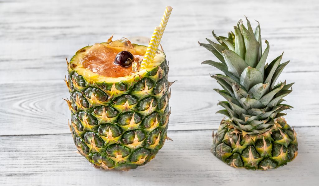 Bahama Mama Cocktail served in hollowed out fresh pineapple